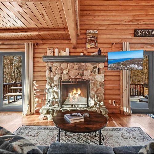 Living room:  the comfy living room with a huge wood fireplace!