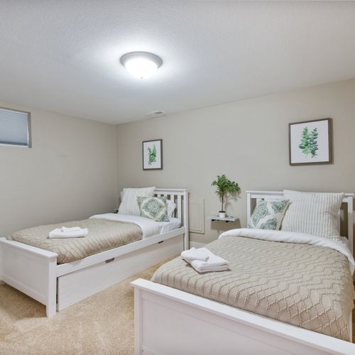 This bedroom finishes the lower level with 2 twin size beds, nightstands, and a closet for added space.