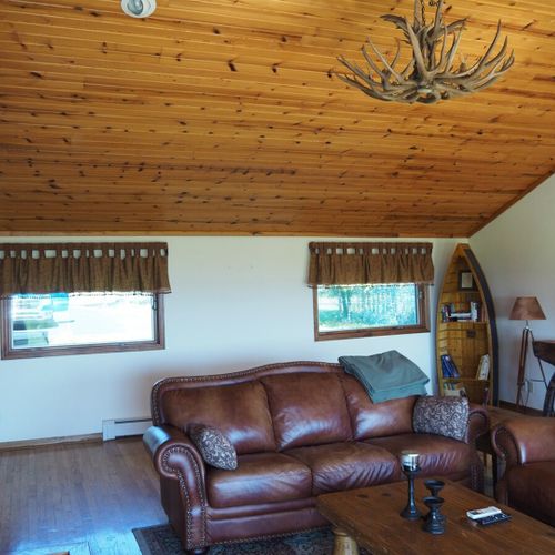 Living room:  the cabin has a huge living room with a gas fireplace and 
 great lake views!