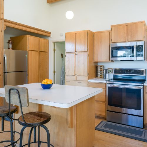 Spacious kitchen and island seating for prepping and cooking your favorite dishes.