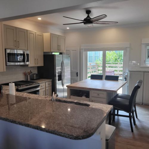 Kitchen:  the home has a newly-renovated kitchen with a large kitchen island and all appliances, including a dishwasher. There is also a good supply of cooking and dining utensils provided.