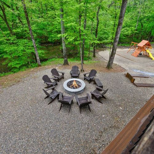 The firepit is found in the back yard and has Adirondack chairs!