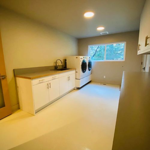 Large laundry room with new LG washer and dryer.  Ironing board, iron, broom/vacuum, extra paper products, and baby accessories are all located here.  Laundry soap, spot remover, and oxy bleach are provided.