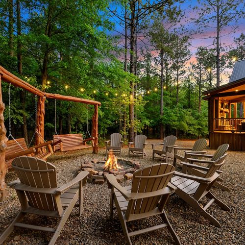 Fire pit with Adirondack chairs and custom swings!