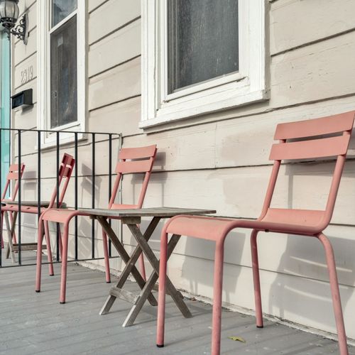 Charming front porch w/ seating — your go-to spot for a slow morning coffee.