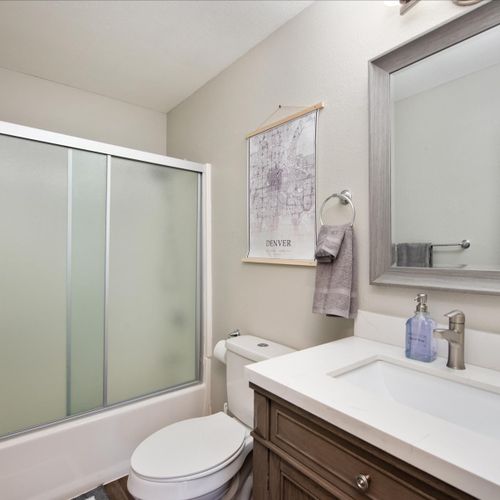 You’ll find two clean and fully stocked bathrooms in this home with two shower/tub combos. They feature bright lighting, large mirrors, hotel grade towels, and all the bathroom essentials, like shampoo, conditioner, and body wash that your group may need.