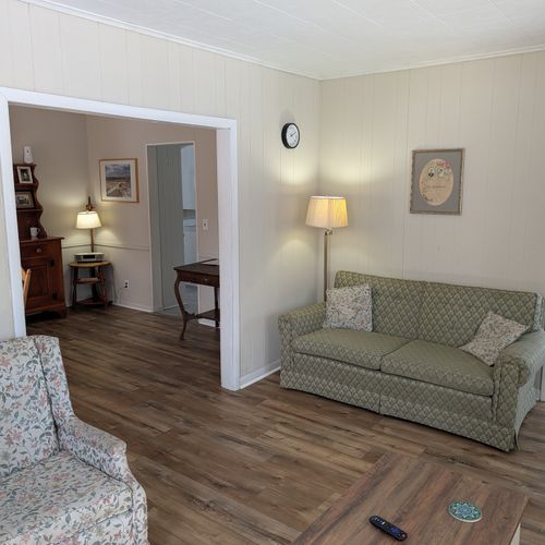 LIVING ROOM:  Very comfy and cozy living room with 2 sofas, a futon, a rocking chair, coffee table, new flooring, and new live streaming television.
