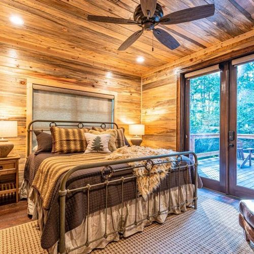 A King Suite with direct patio access and lounging chair.