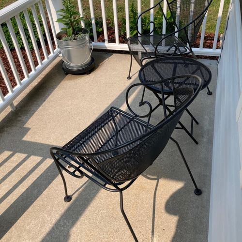 Exterior:  there's a very cute little front porch patio with two chairs and a table.