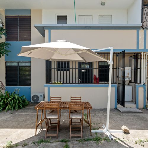 Al Fresco Dining Dreams: Enjoy delightful meals under the sun or stars on our charming outdoor patio, complete with comfortable seating and a large umbrella for shade.