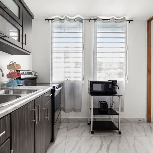 Whip up delicious meals with ease in this well-appointed kitchen.