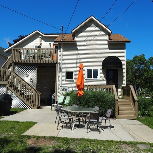 Overall:  the back of the building. The main entrance to the apartment is from the second floor deck.