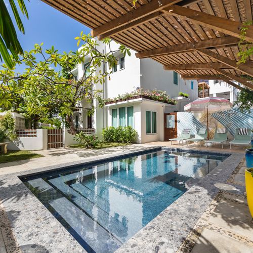 Experience outdoor bliss with a refreshing dip in your exclusive swimming pool.