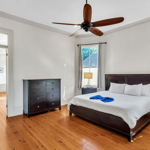 Elegant bedroom with natural light and charm.