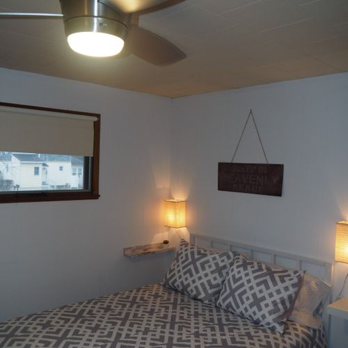 Bedroom #2:  features a full-size bed, bunk bed (i. E. 2 single beds on top of each other), ceiling fan, dresser, mirror, and closet.