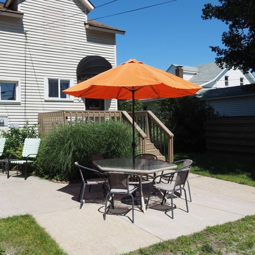 Exterior:  another view of the backyard and outdoor dining furniture