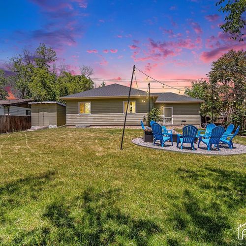 Unleash the joy of play as your kids and furry companions roam freely in the large, fenced yard!