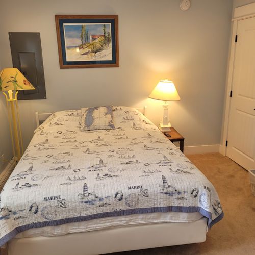 Bedroom #2 (larger house, main floor):  features a queen-size bed, closet, television, and its own private en suite full bathroom.