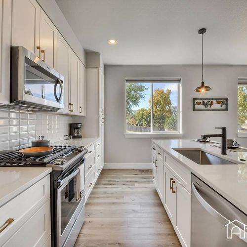 The spacious kitchen has plenty of counter space and modern appliances.
