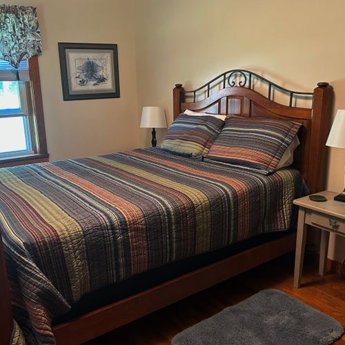 Bedroom #1: features a queen-size bed, nightstands, lamps, and closet.