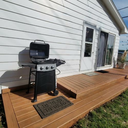 Exterior:  a closer view of the side deck and the propane grill.