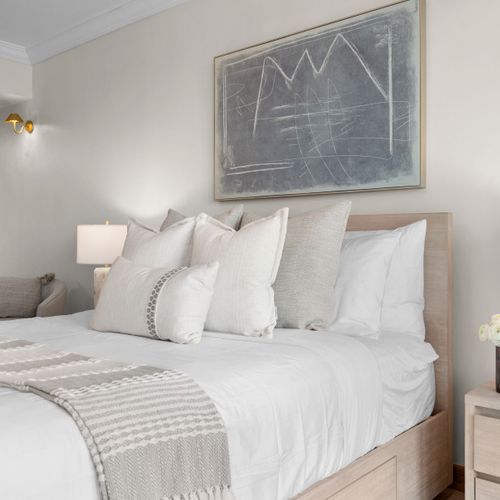 Comfortable studio bedroom with a ceiling fan, TV, and direct access to stunning views.