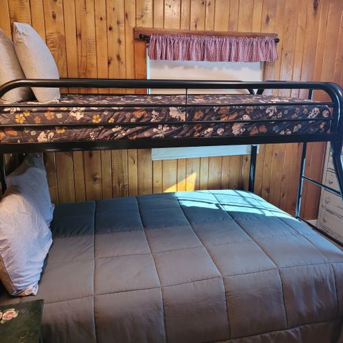 Bedroom #2:  features a twin-on-full bunk bed, which allows 3 people to sleep in the room. Also includes a dresser and mirror.