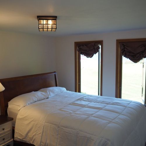 Bedroom #1:  features a queen-size bed, desk, and a nice view of lake michigan!