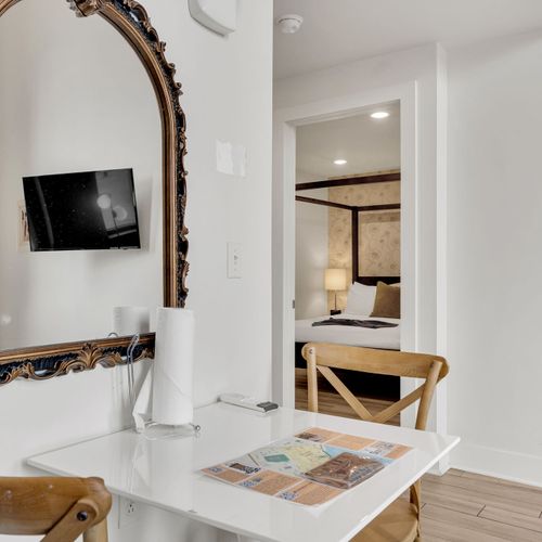 Charming dining nook with vintage flair—perfect for a cozy meal or planning your day in the city.