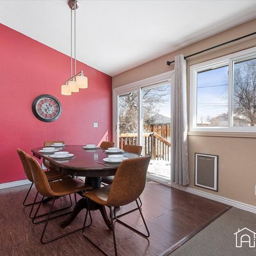 - dine in style at this sunlit table for six, set against a bold red accent wall and large windows
- sliding doors open to the deck for seamless indoor outdoor flow
- warm, welcoming space for shared meals, game nights, or morning coffee