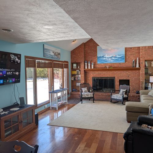 LIVING ROOM #1:  The primary living room, which has a great view of Big Platte Lake!  (Note that the fireplace is not usable.)