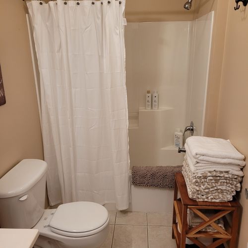 BATHROOM #1 (FIRST FLOOR):  Full bathroom on the first floor with combination tub and shower.