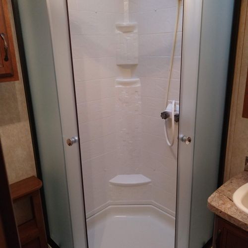 Bathroom #2:  full bathroom with a shower, sink, vanity, and toilet.
