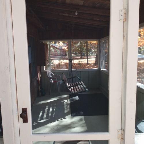 Front porch: the private screened-in front porch.