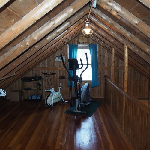 Loft area:  there is a large upstairs loft with a full-size bed, a twin bed, and some older exercise equipment that is available for guests to use.