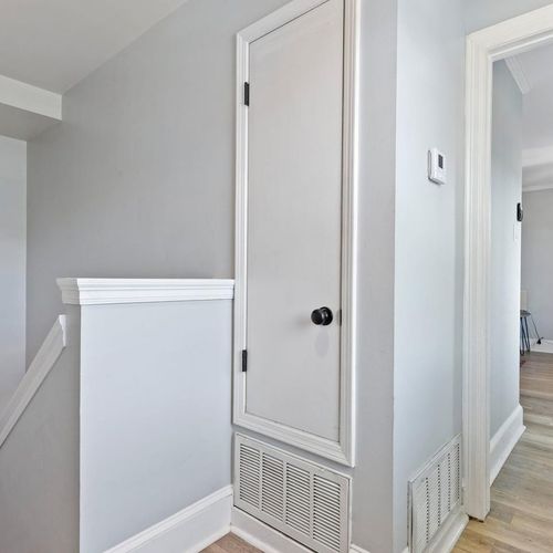 Hallway w/ easy access leading up to the second floor master bedroom.