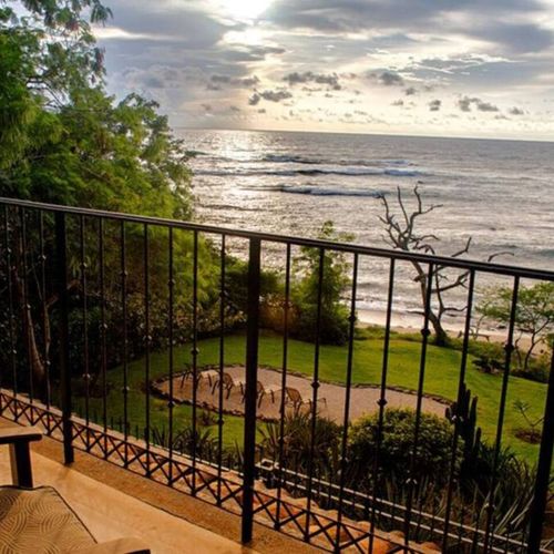 Watch the waves roll in under the crystal blue sky.