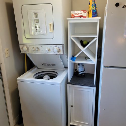 LAUNDRY:  There is a stacked washer and dryer next to the back door.