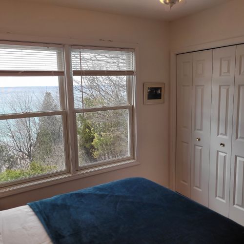 Bedroom #3 (upper level):  features a full-size bed, ceiling fan, closet, and great views of lake michigan.