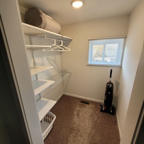 Bedroom #1:  features a queen-size bed, private en suite full bathroom, private television, walk-in closet, dresser, mirror, nightstands, and lamps