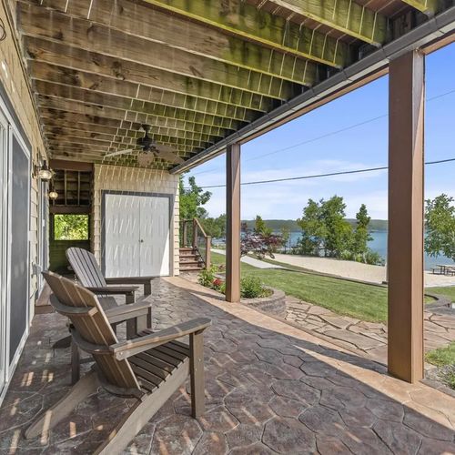 EXTERIOR:   Looking out from the beautifully relaxing back porch towards Crystal Lake