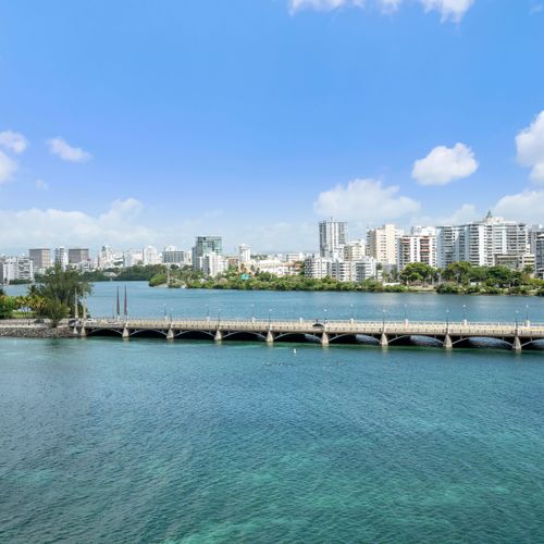 Breathtaking panoramic views of the glistening Condado Lagoon and San Juan's dynamic skyline.