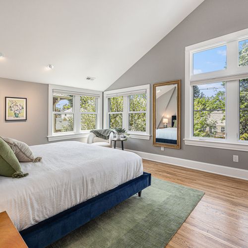 Bright and airy master bedroom with luxurious bedding.