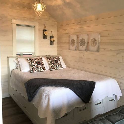 Enjoy the view from this queen size bed with custom built platform with plenty of drawers.