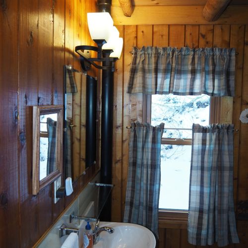 Bathroom (main floor):  the cabin has a full bathroom on the main floor with a combination tub / shower.