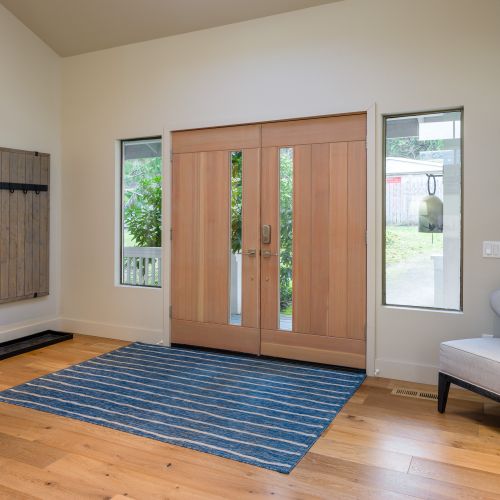 Front entry with a guest bathroom and bedroom ensuite on the main level for easy access.