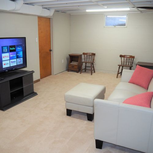 Entertainment / game room:  the basement is partially finished and does feature this fun kids / entertainment / game room.