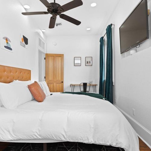 Airy bedroom 2 viewed from the balcony door — bright, open & easy to unwind in.