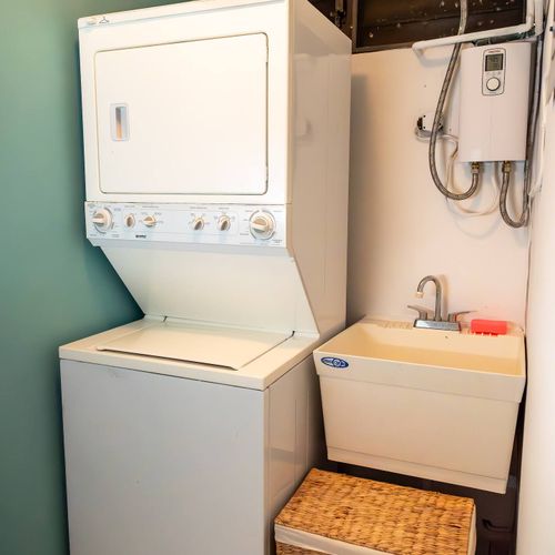 No need to overpack! Our dedicated laundry area with a washer, dryer, and utility sink provides ultimate practicality for your comfort throughout your stay.