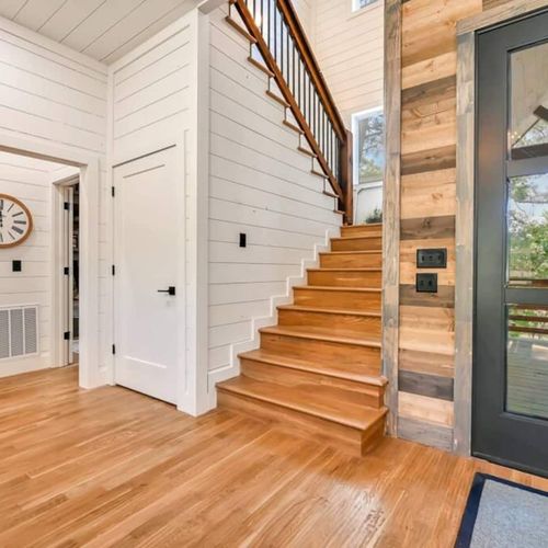 Ascending to the second floor are 4 additional bedrooms.